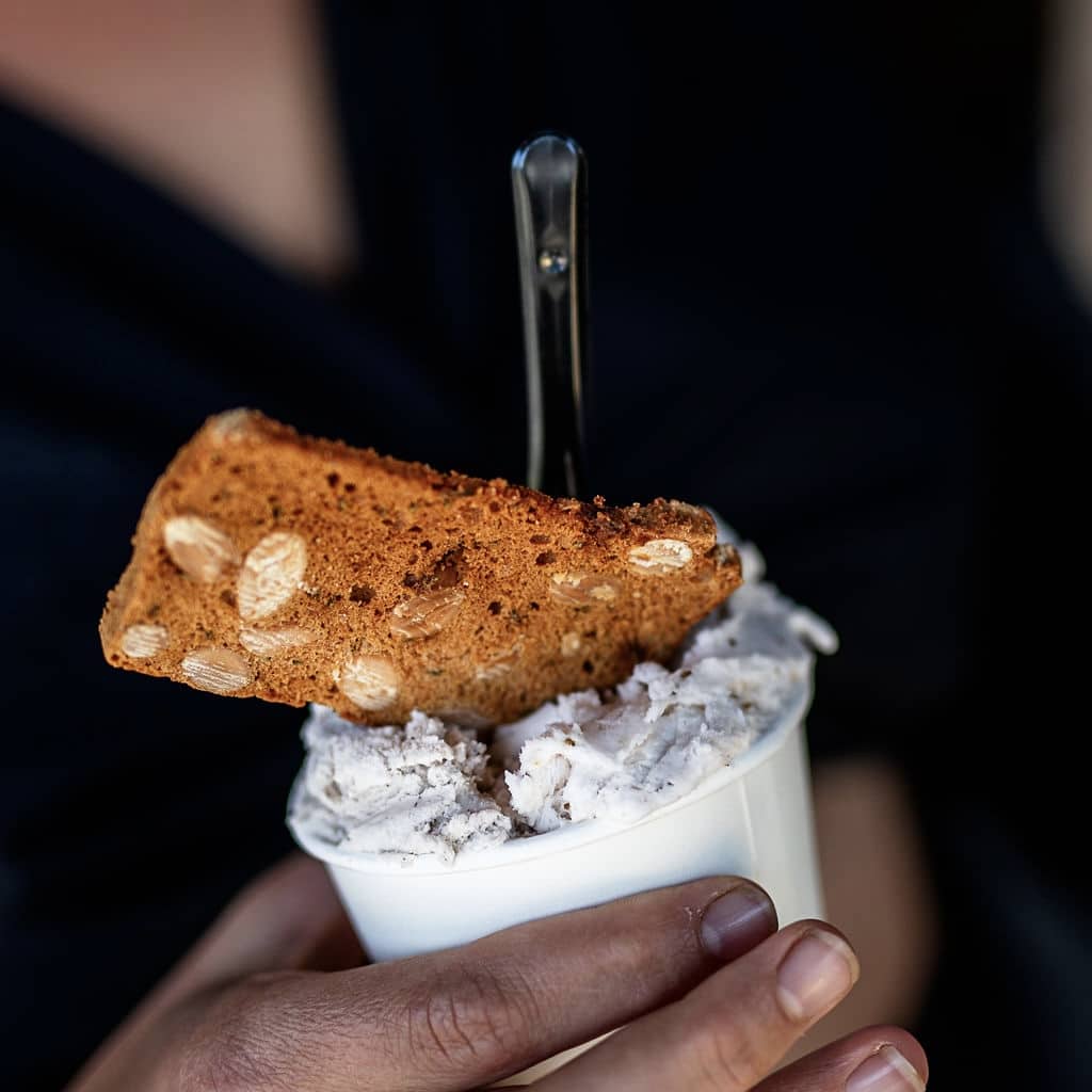 Handmade ice cream topped with almond biscotti, enjoyed on Tasmania’s Tasting Trail.