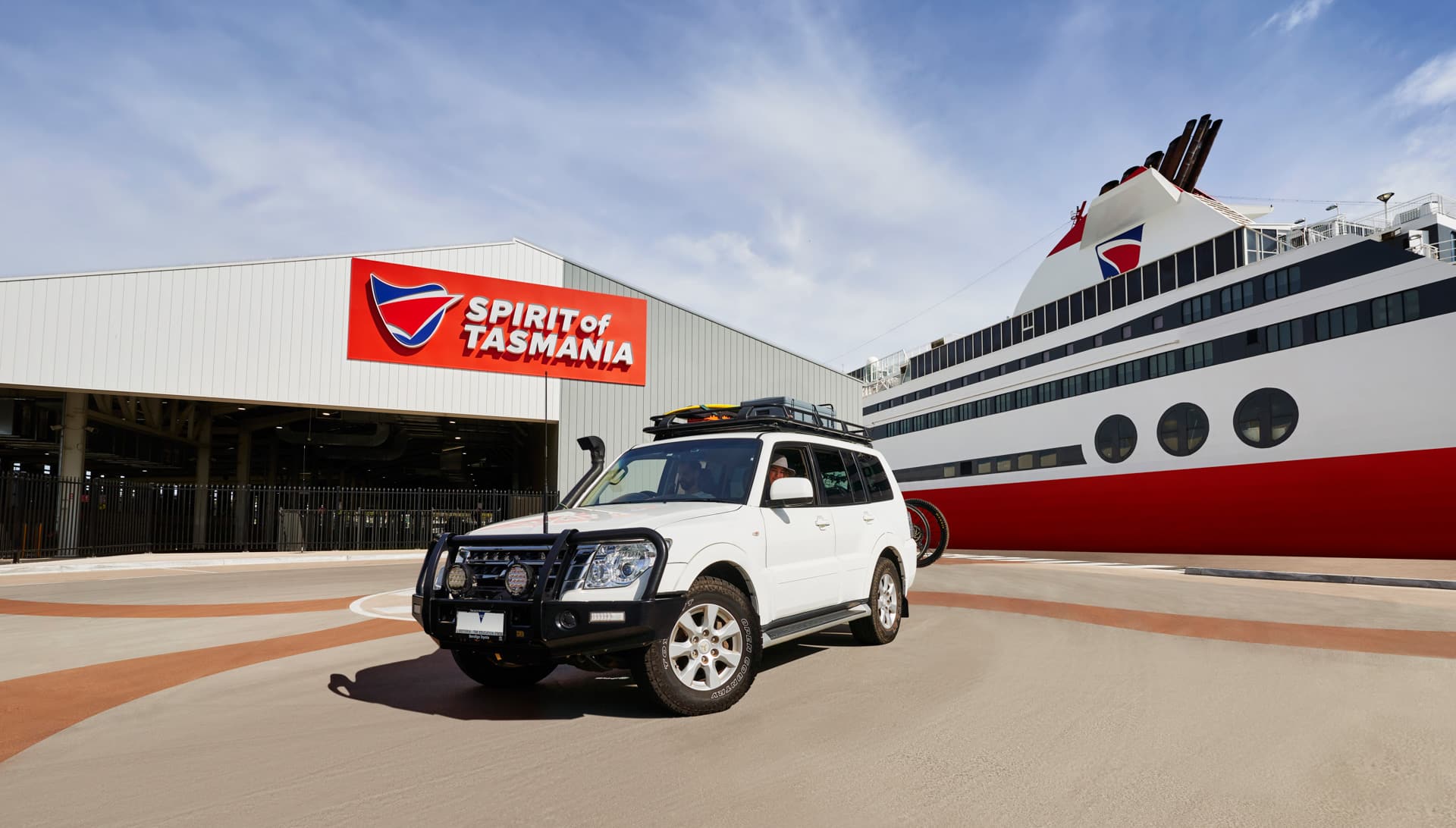 Vehicle beside a Spirit of Tasmania ferry at the Devonport terminal