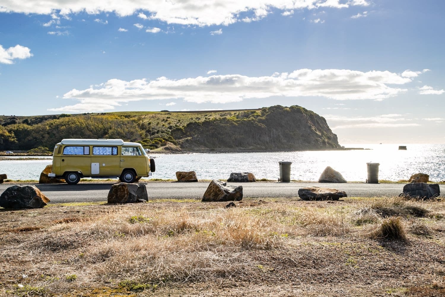 Campervan parked in the foreground with Devonport visible in the background.