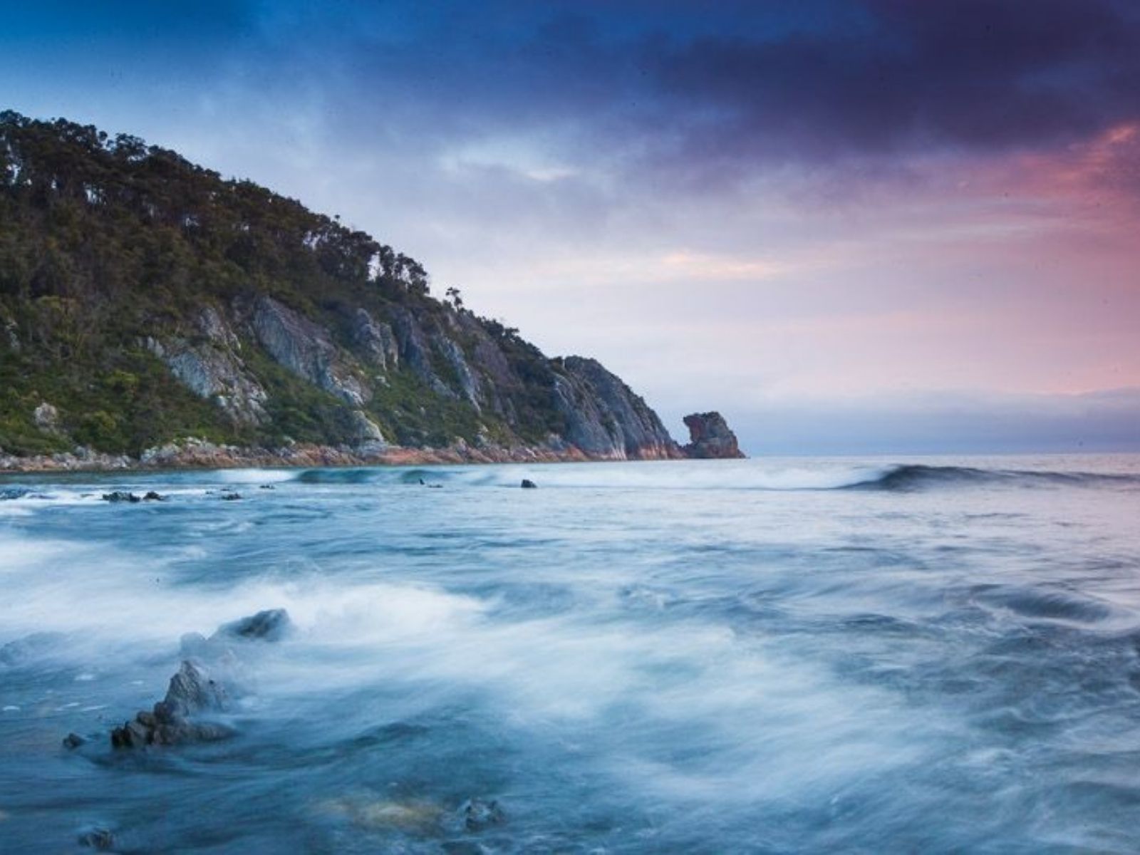 Rocky headland and waves at Sisters Beach on Tasmania’s north-west coast