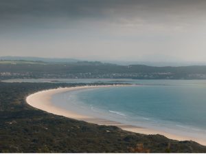 View from Archers Knob across the sweeping coastline and sandy beach in Narawntapu National Park, Tasmania.